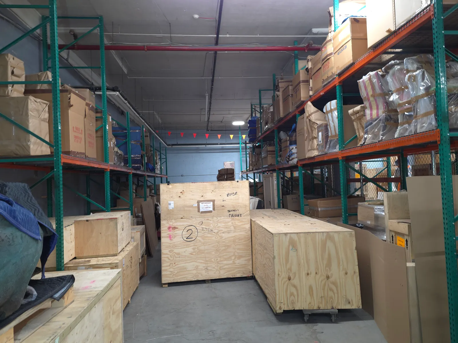 Pallet racking aisle with wrapped artworks in our NYC facility