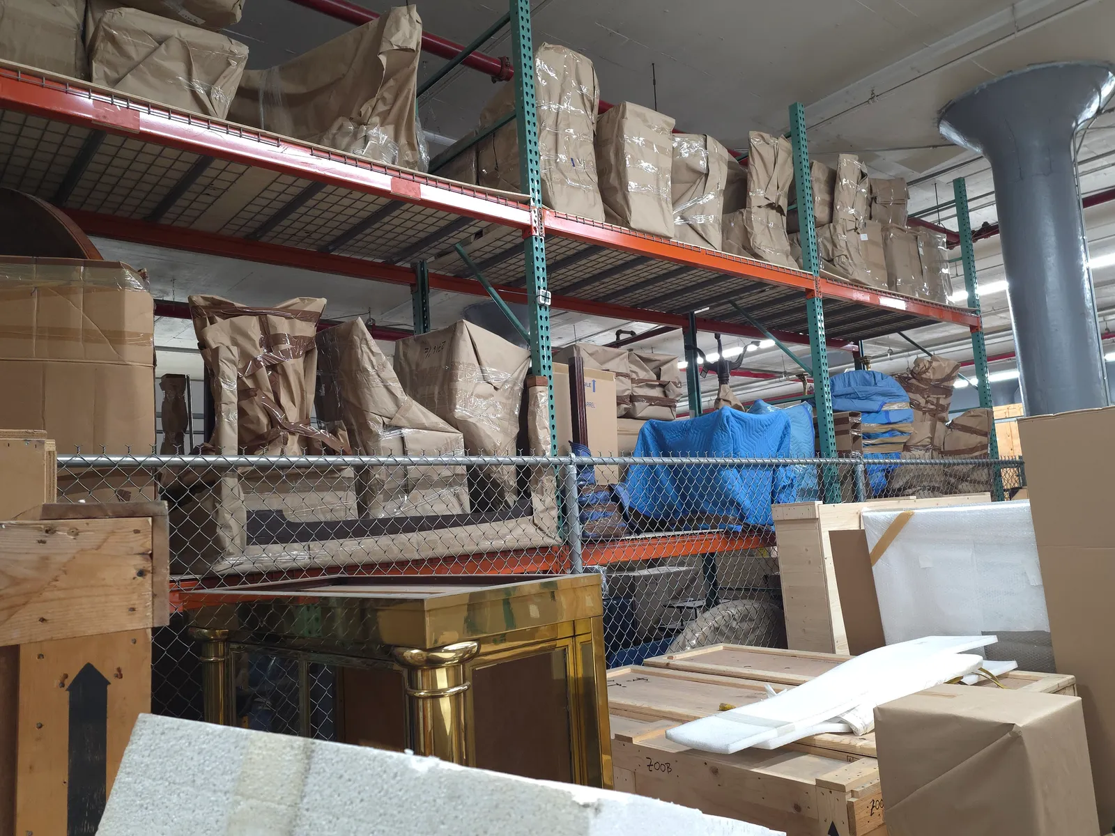Wrapped and padded artworks secured on shelving